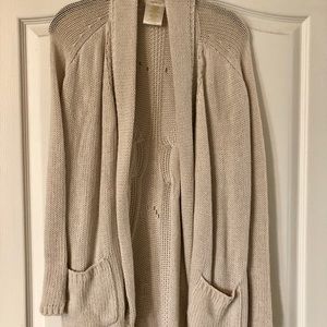 Tan colored knit cardigan.